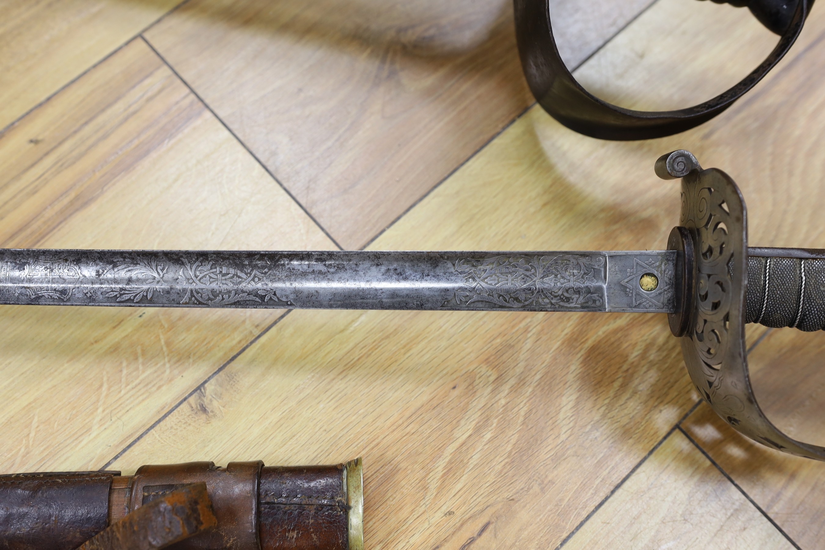 A 19th century Naval sword marked Wilkinson and a Hawks and Co. George V officer's dress sword and two bayonets